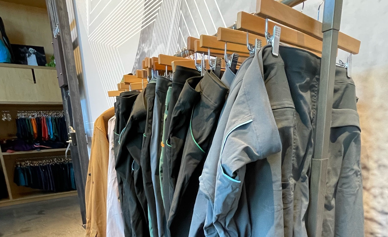 A clothing rack filled with the Ponderosa Pants in a store