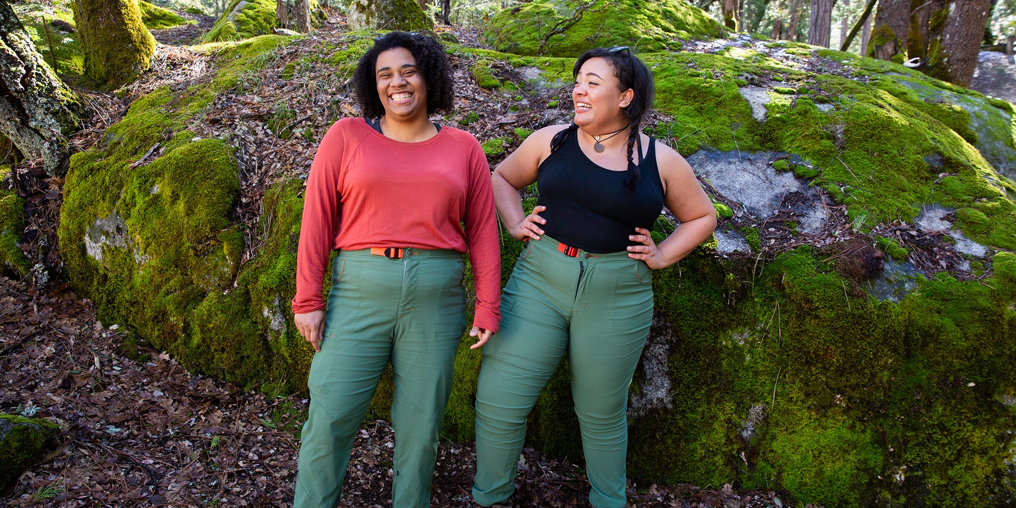Two women of color wearing green plus size women's hiking pants 
